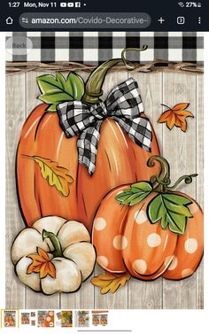 an image of pumpkins with bows on them