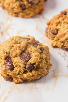 chocolate chip cookies are sitting on a table