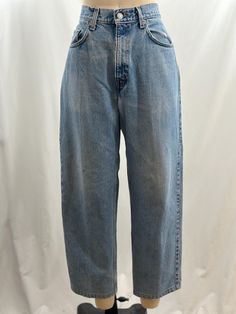 Classic pair of vintage Levi's 00s 550 denim. High waisted, they have a medium wash with a slightly distressed look with a worn in look. The jean you will have forever. -Vintage 90s Levi's 550 -Light wash, distressed  -Machine wash recommended Measurements: *Waist 16 inches *Rise 11 3/4 inches  *Hips 19 inches seam to seam, 20 inches laid flat *Inseam 27 inches *Length 37 1/2 Inches *This item is pre-loved and there may be minor flaws to the garment. Not to worry if there is anything major we will let you know. *light distressing, slightly grunge worn in look --Please read shop policies thoroughly relating to sizing, returns will not be accepted. I encourage you to ask questions for additional pictures, measurements, etc.- Jean Vintage, Levis 550, Grunge Look, Medium Wash Jeans, High Rise Denim, Vintage Levis, High Jeans, Halloween Shopping, Vintage 90s