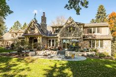 a large house with lots of windows in the front yard