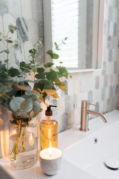 As a Style Curator bathroom makeover, this bathroom has stolen our hearts with ming green paddlepop tiles and gorgeous finishings. The green tonal fish tail tiles with this white shaker vanity, white basin, brushed nickel taps and white square mirror all play a part in this gorgeous bathroom. Click on the pin or go to StyleCurator.com.au to find more. Sage And Marble Bathroom, Light Green Bathroom Aesthetic, Bathroom With Green Accessories, Green And White Marble Bathroom, Ming Green Marble Bathroom, White And Silver Bathroom Ideas, Sage Green Bathroom Accessories, White Bathroom Styling, Bathroom Green Decor