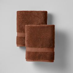 two brown towels sitting next to each other