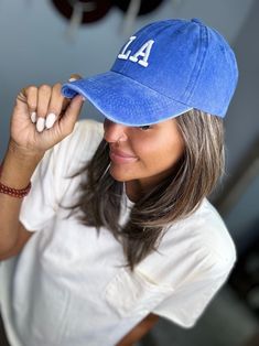 LA Embroidery Cap to go with your everyday outfit!! features a button and buckle closure in the back Trendy Blue Cotton Snapback Hat, Adjustable Blue Baseball Cap For College, Casual Adjustable Trucker Hat For College, Casual Blue Baseball Cap For College, Blue Embroidered Visor Baseball Cap, Blue Casual Hat With Letter Patch, Blue Baseball Cap With Letter Patch And Curved Brim, Trendy Blue Hats With Embroidered Logo, Blue Casual Baseball Cap With Letter Patch