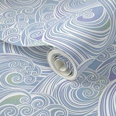 a blue and white wallpaper with swirls on it