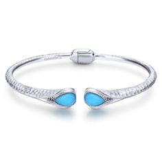 With a vintage feel, this hinged-cuff style bangle bracelet's outside has a hand-hammered look and two vibrant turquoise gemstones that give a dramatic splash of color against the silver setting. Turquoise Rock, Wedding Ring Necklaces, Bracelet Box, Classic Wedding Band, Metal Shop, Hinged Bracelet, Pendant Bracelet, Rock Crystal, Turquoise Gemstone