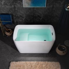 a bathroom with a bathtub and rug on the floor