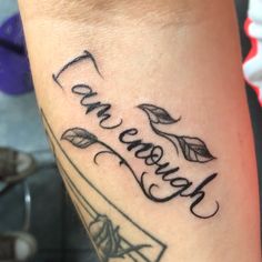 a close up of a person's arm with a tattoo that reads, love and care