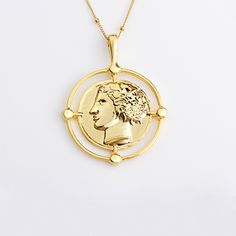 "♥Ancient Greek Gold Coin necklace is a perfect accessory for any outfit. It is made with 14K Gold filled chain and 14K plated charm M A T E R I A L S * A N D * D E T A I L S - 14K Gold filled chain of your choice. Select the one you like from the drop down menu - 14K Gold plated coin charm C O I N * D I M E N T I O N S 33mm x 43mm (1 1/4\"x 1 5/8\") H O W * T O * O R D E R Select chain length from the 1st drop down menu Select chain type from the 2nd drop down menu Select quantity from the 3rd Yellow Gold Coin Necklace With Clavicle Chain, Ancient Coin Pendant, Coin Necklace Gold, Antique Medallion, Buddhist Necklace, St Christopher Necklace, Buddha Necklace, Ancient Coin, Gold Coin Necklace