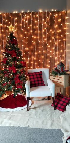 a living room decorated for christmas with lights and a large tree in the corner next to a chair