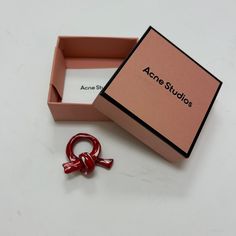 Acne Studios Knot Ring In Red - Ceramic Made In Italy. Size S. In Excellent Condition - So Chic. Tags: Acne Studios, Ring, Jewelry, Accessories, Knot Ring, Runway, Designer, Avant Garde, Street Style, Fashion, Style, Boho, Bohemian, Ceramic, Red Ceramic, Acne Jewelry, Acne Accessories Designer Red Jewelry Gift, Designer Red Jewelry As Gift, Designer Red Jewelry For Gift, Avant Garde Street Style, Red Ceramic, Knot Ring, Street Style Fashion, Ring Color, Style Boho