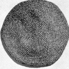 a black and white photo of a round object