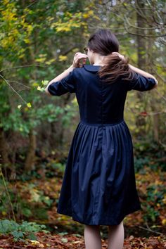 Navy wool pleated midi dress for women with Peter Pan collar great for winter in sizes XS - XXL ❃ The power of a beautiful dress is not to be underestimated. The right dress can transform your confidence and break hearts from across the room. Unlock that power with this simply beautiful 1950s dress. ❃ If you dare to think differently when it comes to dressing, this A line black dress will appeal. An intriguing mix of masculine tailoring and feminine flirtatiousness, it's the perfect way to showc Classic Pleated Midi Dress For Fall, Fitted Knee-length Pleated Dress With Box Pleat, Fitted Pleated Winter Dress, Classic Mid-length Dresses For Fall, Classic Mid-length Fall Dresses, Pleated Fitted Dresses For Winter, Fall Midi Dress With Pleated Bodice, Fitted Pleated Dress For Winter, Fitted Knee-length Box Pleat Dress