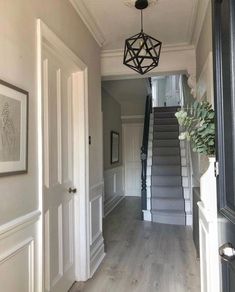 the hallway is clean and ready to be used as an entrance way for someone's home