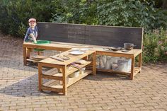 a wooden bench sitting on top of a brick patio