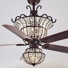 a chandelier hanging from a ceiling fan