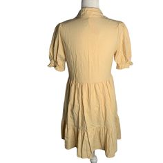 Roylamp Short Sleeve Ruffle Shirt Dress S Yellow Buttons Pockets Side Zipper NEWNew with tagsChest: 17" laying flatSleeves: 12" laying flatWaist: 16" laying flatLength: 34" shoulder to hem65% Cotton, 35% PolyesterMade in China Fitted Collared Shirt Dress With Ruffles, Collared Cotton Shirt Dress With Ruffles, Cotton Collared Shirt Dress With Ruffles, Cotton Mini Shirt Dress With Ruffles, Casual Collared Shirt Dress With Ruffles, Cotton Button-up Mini Dress With Ruffles, Ruffled Button-up Cotton Mini Dress, Cotton Mini Dress With Ruffles And Button-up Design, Ruffle Shirt