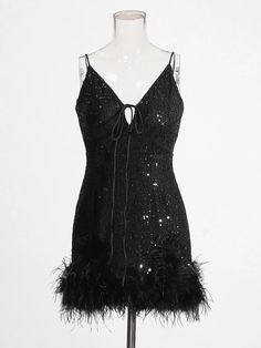 Be the life of the party in this sequin and feather-trimmed mini dress, featuring convertible straps and a fun, flirty silhouette. Everyone will be clucking over your fabulous look! Elasticity: Slight Stretch Decoration: Feathers Material: Polyester Black Sequin Dress With Spaghetti Straps For Party Season, Glamorous Flapper Dress For Holiday Night Out, Glamorous Holiday Flapper Dress For Night Out, Chic Sequin Dress With Feather Trim For Party, Black Glamorous Flapper Dress For Party Season, Glamorous Feathered Sequin Dress For Night Out, Glamorous Sequin Feather Dress For Night Out, Glamorous Black Flapper Dress For Party Season, Feathered Mini Dress For Party