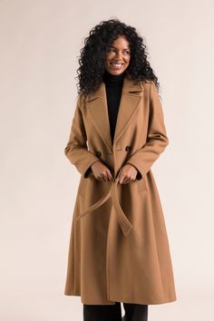 Adopt our long belted coat in camel virgin wool for a chic and modern silhouette. Ideal for all occasions with its belt and iconic woolen cloth     Long, belted coat that gives you a feminine look   Contrast fabric under the collar and inside collar stand and pretty stitching details<   Unique French know-how with creation & prototyping in our own workshop in the North of France   Made in our own factory in Ukraine        SIZE ADVICE    If you are unsure between two sizes, we advise you to take your usual size. North Of France, Stitching Details, Belted Coat, Feminine Look, Long Coat, Quality Fabric, Camel, Ukraine