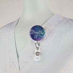 "Funny Nurse Badge Reel with \" Breathe\" in white with a little cardio heart, over a blue and purple watercolor background. ID Badge reels are ideal for Medical staff, Nurses, Doctors, Teachers, Students, Government and Transportation workers who are required to wear identification. I say...why not look stylish while wearing one! You can choose: SWIVEL CLIP Reels are the best choice for Doctors, Nurses and Hospital Staff! Clip attaches to any part of any garment and is great for connecting to a Customizable White Badge Holders For Personal Use, Customizable White Badge Reel, Customizable Adjustable White Badge Holders, Adjustable White Badge Holder For Personal Use, Adjustable Customizable White Badge Holders, Adjustable White Badge Holder As A Gift, Stethoscope Id Tag, Id Lanyard, Medical Gifts