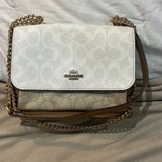 Coach Bag Parker Leather Crossbody Bag Brown Tan And Off White, Leather Used Please Review All The Photos. This Purse Is Absolutely Stunning And One Of The Kind Has Some Minor Wearing ( One Of My Fav Coach Purse I Wore It A Lot And Still Standing Strong) Has A Stain In Front. Interior Is Velvet Feeling Cream Color Can Be Crossbody Or Shoulder Bag Block Color With Monogram Letter “ C “ On It . Straps Is Chain And Leather Pocket In The Back White Tote Bag With Chain Strap, White Clutch Flap Bag With Dust Bag, Luxury White Crossbody Flap Bag, White Top Handle Bag With Chain Strap, White Formal Flap Bag With Chain Strap, Formal White Flap Bag With Chain Strap, White Tote Shoulder Bag With Chain Strap, White Flap Bag For Travel With Dust Bag, White Shoulder Bag With Chain Strap For Travel