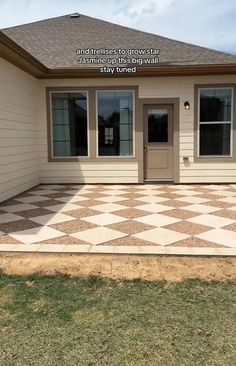 a house that has a checkered floor in front of it