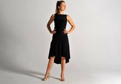 A classic flow dress for tango dancers! Our CARLA dress flows extremely well due to its shorter front, longer back cut and its A-line. It is fitted to the waist. Its fabric is soft and stretches well. This dress can be worn with a normal bra - perfect for dancing all night long. Our Elegant Ballroom Dress, Elegant Dance Dress With Fitted Bodice, Elegant Sleeveless Dresses For Dance, Fitted A-line Dress With Back Opening, Black Fitted Dress With Long Train, Elegant Black Ballroom Dresses, Elegant Fitted Dress For Dance, Elegant Fitted Dance Dress, Fitted Black Dress With Long Train