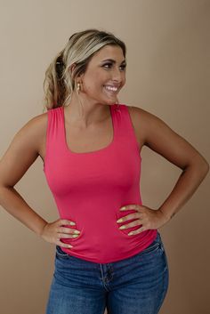 The Daily Bliss Basic Tank features a double-lined fabrication, square neckline, and generous stretch fabrication. The ideal basic to style effortlessly throughout the season. Neckline: Square Fabric: 95% Rayon, 5% Spandex Double lined fabrication Square neckline Generous stretch Imported Fit: True to size!- Chest: Fitted; Generous stretch- Designed to have a an ultra slimming fitted style met with generous stretch fabrication Model Specs: Emily is wearing a size small in the photo.How will this Casual Pink Square Neck Tank Top, Fitted Pink Square Neck Tank Top, Style Wide Leg Jeans, Bride Top, Square Fabric, Exclusive Dress, Everyday Chic, Fitted Style, Curvy Dress