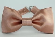 Rose gold satin bow tie, mens bow tie, wedding bow tie, grooms, groomsmen bow tie, ring bearer bow t Adjustable Gold Bow Tie, Gold Elegant Bow With Tie Back, Elegant Adjustable Gold Bow Tie, Dapper Bow Tie With Detachable Bow For Weddings, Dapper Wedding Bow Tie With Detachable Bow, Classic Gold Bow Tie For Groom, Gold Classic Bow Tie For Groom, Adjustable Dapper Bow For Wedding, Dapper Detachable Bow Tie For Weddings