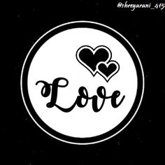 the word love with two hearts in black and white on a round sticker that says,