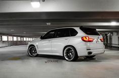 a white car parked in a parking garage