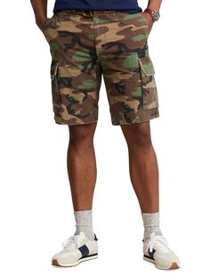 A casual essential for warmer days, these surplus-inspired cargo shorts from Polo Ralph Lauren are cut for a comfortable fit. The classic fit style sits at the waist and is eased through the legs. They're finished with a “Polo RL Brand” patch above the right back pocket.100% cottonBelt loopsZip fly with button closureSide pockets; cargo pockets; back button-through welt pockets“Polo RL Brand” label above the back right pocketXL Sizes have a 10¼" inseam; XLT Sizes have an 11¼" inseam; Size 46W ha Camouflage Military Cotton Shorts, Camouflage Cotton Cargo Shorts With Side Pockets, Military Camouflage Cotton Shorts, Camouflage Cotton Cargo Shorts, Utility Camouflage Cotton Cargo Shorts, Military Style Camouflage Cotton Cargo Shorts, Camouflage Cotton Cargo Shorts With Pockets, Camouflage Cargo Shorts With Cargo Pockets, Casual Camouflage Cotton Cargo Shorts