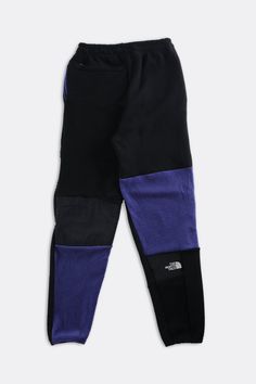 2.0 Patchwork North Face fleece pants featuring additional patchwork style lines. Recycled from 3 vintage jackets with an adjustable elastic pull tab waist. Sourced and reworked in CanadaMeasurementsSize: Women's XSCondition: Good vintage conditionColour: Purple blue and black Sporty Patchwork Pants For Streetwear, Urban Patchwork Bottoms For Fall, Fleece Pants Women, North Face Fleece, Fleece Pants, Vintage Jackets, Blue And Black, Vintage Jacket, Pull Tab