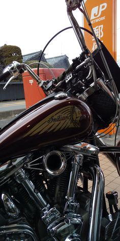 a close up of a motorcycle parked in a parking lot