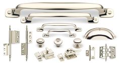 an assortment of hardware and door handles on a white background