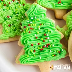 green christmas tree cookies on a white plate