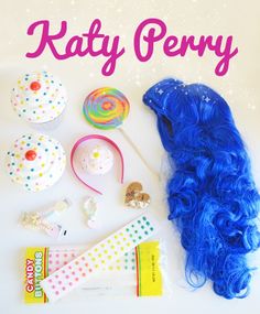 there is a blue wig, lollipops, and candy on the table