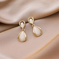 Lend a polished finish to ensembles with these elegant drop earrings boasting 18k gold-plated metal and cateye. 0.55" W x 1.14" L 18k gold-plated copper / cateye Gold-tone Elegant Teardrop Earrings, Rose Gold Teardrop Earrings, Hypoallergenic Gold Plated Teardrop Earrings, Trendy Teardrop Jewelry For Formal Occasions, Elegant Hypoallergenic Gold Plated Teardrop Earrings, Rose Gold Metal Teardrop Earrings, Elegant Gold Teardrop Hypoallergenic Earrings, Elegant Gold-tone Teardrop Earrings, Formal Hypoallergenic Metal Teardrop Earrings