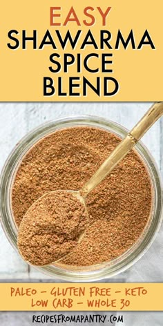 easy shawama spice blend in a glass bowl with a wooden spoon on the side