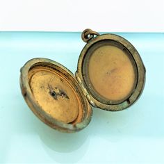 "This is a beautiful gold filled Victorian era locket. The piece is made of gold filled metal set with tiny seed pearls. The interior only has the glass and frame on one side. The locket is in vintage condition with wear consistent with age. Please view all of the pictures for a full view of the piece. The locket measures 1.5\" long and .95\" wide. If you have any questions or would like to see additional pictures, please contact us before making your purchase. Buyers outside the United States, Antique Gold Openable Jewelry, Antique Gold Medallion Locket Necklace Vintage Style, Vintage Locket Necklace With Antique Finish For Formal Events, Vintage Locket Necklace With Antique Finish For Formal Wear, Victorian Locket Jewelry, Antique Gold Locket Necklace, Vintage Locket Necklace With Antique Finish For Formal Occasions, Vintage Antique Gold Locket Necklace For Formal Occasions, Antique Gold Vintage Locket Necklace For Formal Occasions