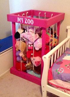 a small child's room with a toy crib and toys on the floor