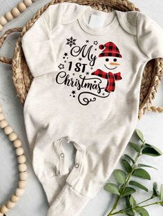 Personalized Baby Romper: Celebrate Your Baby's First Christmas in Style Your baby's My First Christmas Outfit should be memorable, and our Baby Romper is here to make it unforgettable. Personalized and designed for comfort, it's the must-have attire for your baby's first Christmas. Why choose our Personalized Baby Romper for your baby's first Christmas? Personalized Perfection: Customize it with your baby's name, marking this momentous occasion. Comfortable & Stylish: Crafted from gentle materi My First Christmas Outfit, First Christmas Outfit, My 1st Christmas, Christmas Romper, Snowman Design, My First Christmas, Baby's First Christmas, Organic Baby Clothes, Coming Home Outfit