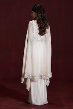 Ivory cape with hem work of sequins and cutdana embroidery. Paired with padded blouse and draped skirt. - Aza Fashions White Sets With Dupatta And Cape Sleeves, Cape-shaped Dupatta For Wedding, Cutdana Embroidery, Padded Blouse, Women Kurta, Draped Skirt, Set Women, Rococo, Aza Fashion