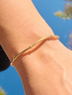 Dainty 2mm Tube Beaded Bracelet, These are real 14K Gold Filled Beads that WILL NOT TARNISH. 100% Guarantee- so yes, you can shower, go in the ocean etc. with these. The perfect addition to layering with other dainty bracelets. An elegant, simple piece that transitions well and stacks well with any arm party. Bracelet measurement: 6.75" Stretch Price per bracelet.  Material: 14 Karat Gold Filled, Hypoallergenic. Tarnish Resistant. Gold-filled does not de-laminate or peel like Gold plated Jewelry Dainty 14k Gold-filled Stretch Bracelet, Adjustable 14k Gold Bracelet, Tarnish Resistant, Gold Hand-strung Stretch Bracelet In 14k Gold-filled, Everyday Stackable 14k Gold-filled Stretch Bracelet, Adjustable Stackable 14k Gold-filled Stretch Bracelet, Tube Bead Bracelet, Arm Party, Alessandra Ambrosio, Stackable Bracelets