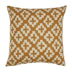 a brown and white pillow with an abstract design on the front, sitting on a white background