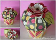 there is a cupcake decorated with flowers on the top and bottom, along with other pictures