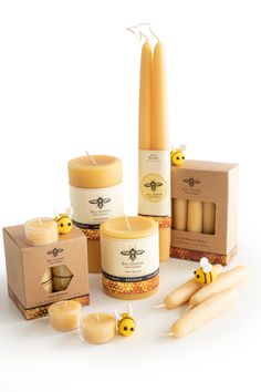 beeswax candles and boxes on a white background