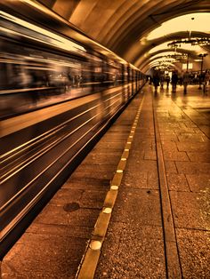 the train is moving fast through the tunnel