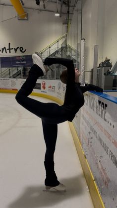 a woman is practicing her moves on the ice