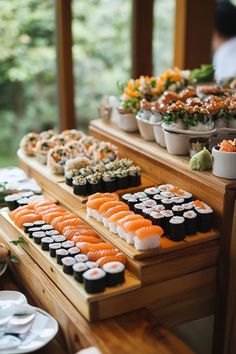 an assortment of sushi on display at a buffet