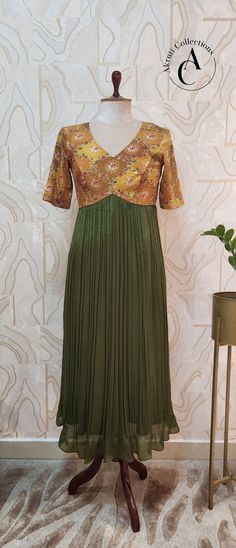 Material: Georgette dress. Size:38 and 48 in length. Back open with zipper. Summer Anarkali Dress In Pista Green, Pista Green Anarkali Dress For Summer, Summer Pista Green Anarkali Dress, Summer Green Georgette Anarkali Set, Green Georgette Anarkali Set For Summer, Green Maxi Gown With Pleated Bodice, Green Gown With Pleated Bodice And Maxi Length, Designer Summer Green Dresses, Bollywood Style Pista Green Dress For Spring